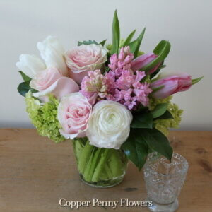 Sweet Spring flower arrangement from Copper Penny Flowers features roses and tulips in pinks and whites