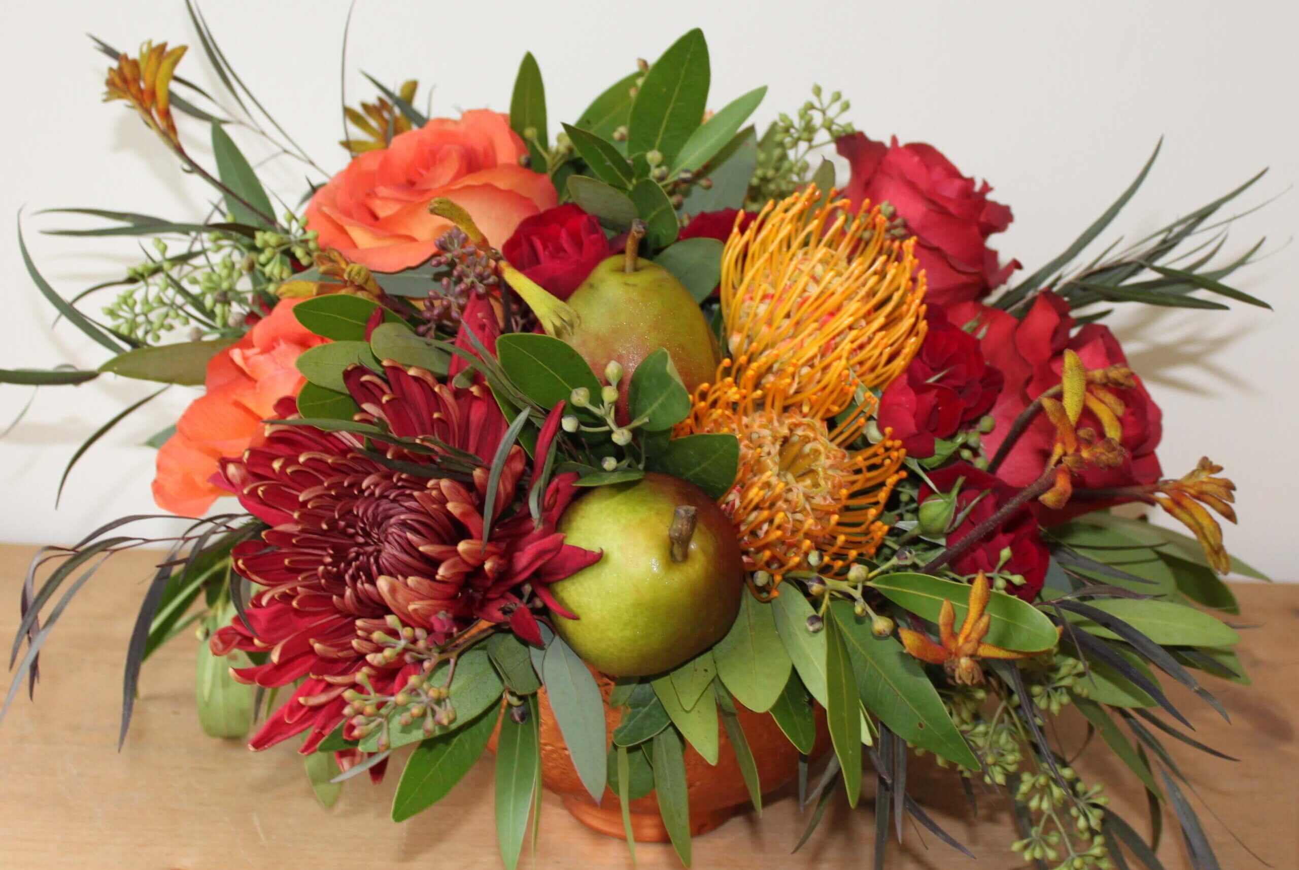 Pearfectly Autumn floral design roses mums protea pears seeded eucalyptus