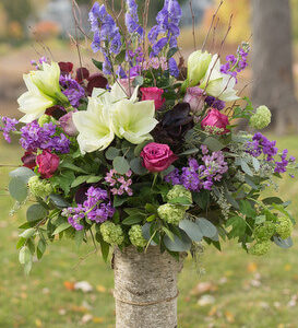 purple wedding arrangement in birch by copper penny flowers
