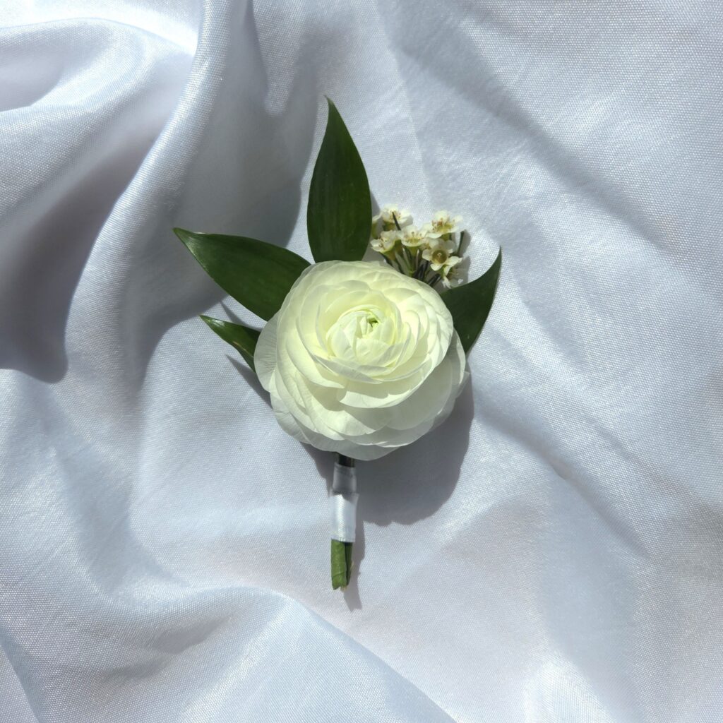 A Boutonni&egrave;re features premium blooms with greenery mounted on our preferred magnetic fastener.