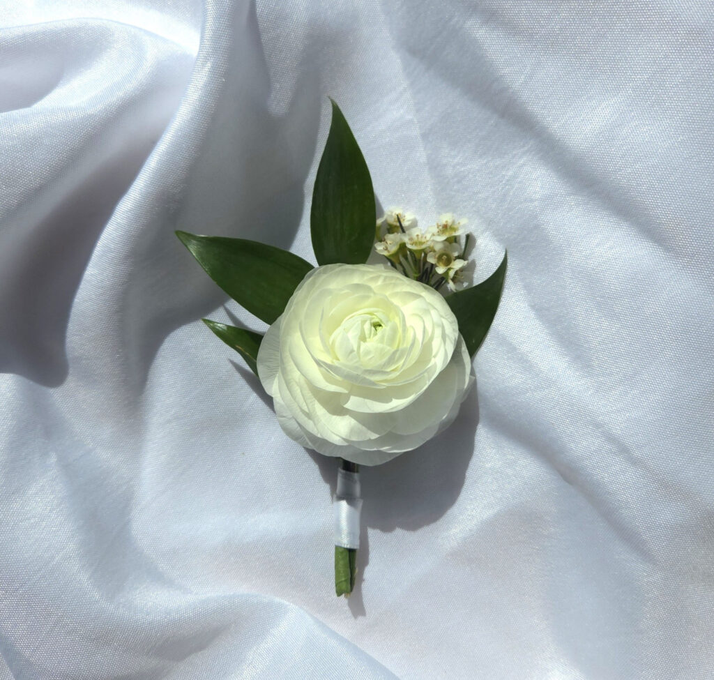 A Boutonni&egrave;re features premium blooms with greenery mounted on our preferred magnetic fastener.