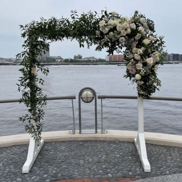 white wooden wedding arbor