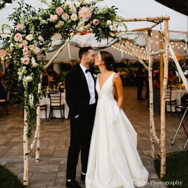wooden birch wedding arbor