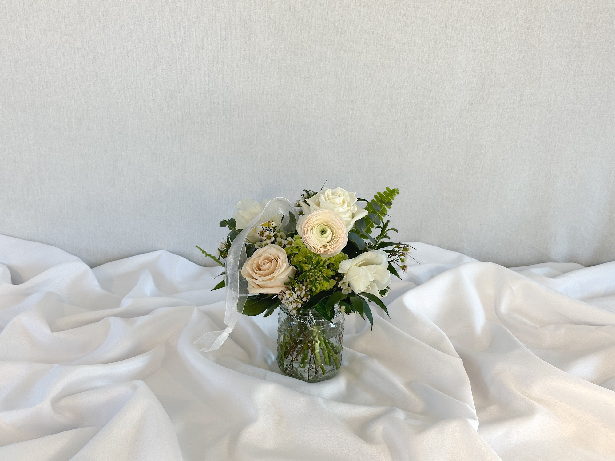 Wedding ceremony aisle arrangement florals