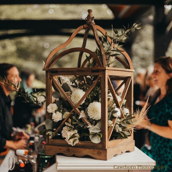 wooden lantern with wedding florals